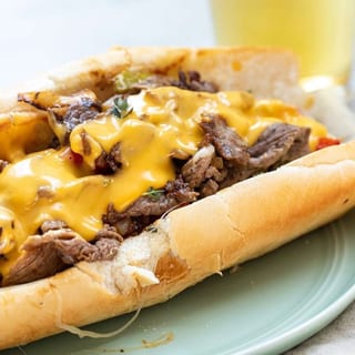12'' Philly Cheese Steak SUBS w/ Fries Served with Green Pepper, Onion and Mushroom