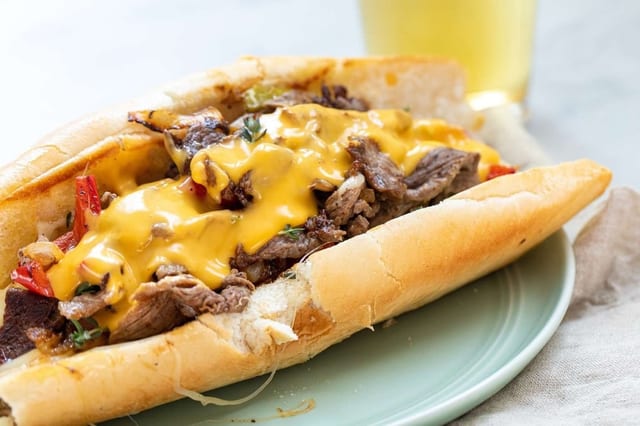 12'' Philly Cheese Steak SUBS w/ Fries Served with Green Pepper, Onion and Mushroom.