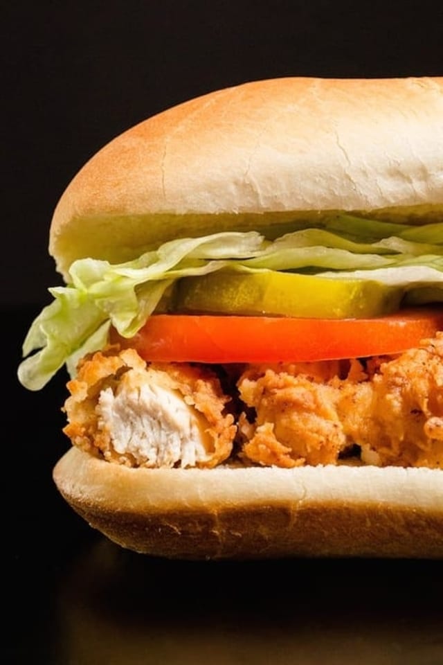12'' Chicken Tender SUB w/ Fries Served with Lettuce, Onion Tomato and Mayo.